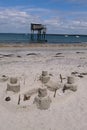 Joalland beach with a sandcastle and a plaice fishing hut