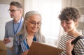 Job centre employee helping young woman to fill form to find a job. Royalty Free Stock Photo