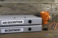 Job Description and Recruitment - two folders on wooden office d Royalty Free Stock Photo