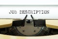 Job description word typed on a yellow vintage typewriter. Business concept