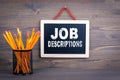 Job Descriptions. Career and success concept. Chalkboard on a wooden background