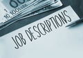 Job Descriptions text, 100 Euro bills. Career development huan resources concept