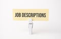 Job Descriptions text on paper. On white background Royalty Free Stock Photo