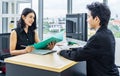 Job interview, Beautiful manager asian woman talking to a male job applicant at the desk,