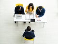 Job interview concept. Diverse hr team doing job interview with a man in business office. Human resources team interviewing a Royalty Free Stock Photo