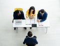 Job interview concept. Diverse hr team doing job interview with a man in business office. Human resources team interviewing a Royalty Free Stock Photo