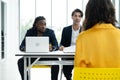 Job interview concept. Diverse hr team doing job interview with a woman in business office. Human resources team interviewing a Royalty Free Stock Photo