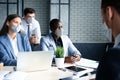 Job interview with the employer, business team in medical masks listen to candidate answers