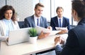 Job interview with the employer, businessman listen to candidate answers. Royalty Free Stock Photo