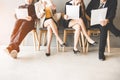 Job Interview. Group of asian people review document while waiting for job interview. Royalty Free Stock Photo