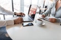 Job interview - successful businessman with laptop listens to candidate`s answers. Young business woman in a modern office