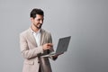 man suit beard laptop computer copyspace freelancer smiling internet job business