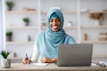 Job For Muslim Women. Black Islamic Female Sitting At Desk With Computer