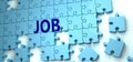 Job puzzle - complexity, difficulty, problems and challenges of a complicated concept idea pictured as a jigsaw puzzle tiles with Royalty Free Stock Photo
