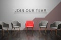 Job recruiting advertisement represented by `join our team` texts on the chairs or wall. One chair is colored differently to