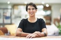 Job satisfaction is a great motivator. Cropped portrait of a young businesswoman sitting at her desk in her office.