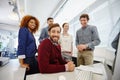 Job satisfaction is a great motivator. Portrait of a group of businesspeople having a meeting in their office.