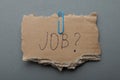 Job search in a crisis, poverty. The inscription on the torn cardboard