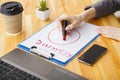 Job search. Female hand writes resume with lipstick on white she