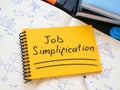 Job simplification inscription and notepads with calculations.