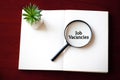 Job Vacancies title in magnifier glass.