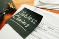 Jobless claims memo stick and pile of documents Royalty Free Stock Photo