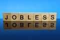 jobless word on wooden blocks on the mirror table Royalty Free Stock Photo