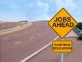 JOBS AHEAD CONTINUE EDUCATION road sign positive message of success