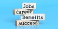 Jobs, career, benefits, success - words on wooden blocks