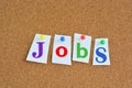 Jobs and career concept with colorful paper pins on billboard Royalty Free Stock Photo