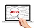 Jobs Search with a magnifying glass on Laptop
