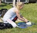 Jockey Malin Holmberg weighing before the gallop horse race to adjust the extra weight in her vest