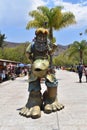 Vertical view of a statue of a giant fisherman on the boardwalk of Jocotepec.