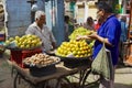 Man buys fruits at the street market in Jodhpur, India.