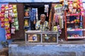 An Indian vendor waiting for customer at his grocery store
