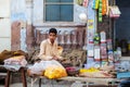 Indian vendor waiting for customer