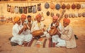 Happy musicians playing music on different traditional instruments outdoor Royalty Free Stock Photo