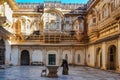 Jodhpur, India - Jan 02, 2020: Unidentified woman cleans the floor at Mehrangarh Fort in Jodhpur, Rajasthan, India Royalty Free Stock Photo