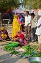 Jodhpur, India - January 2, 2015: Indian people shopping at typical vegetable street market in India.