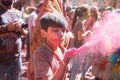 Jodhpur, rajastha, india - March 20, 2020: cute little indian kid celebrating holi festival, closeup of face covered with colored