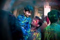 Jodhpur, rajastha, india - March 20, 2020: Young indian father and son celebrating holi festival, closeup of face covered with