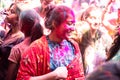 Jodhpur, rajastha, india - March 20, 2020: Young indian woman celebrating holi festival, face smeared covered with colored