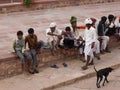 Numerous people sitting on a wall of the Mehrangarh Fort in the blue city of Jodhpur, India