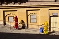 Two women in traditional Indian cloth sweeping the courtyard Royalty Free Stock Photo