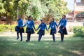 Jodhpur, rajasthan, india - Decemvber 18th, 2019: Indian asian happy school girls holding hands and walking playing in a garden