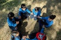 Jodhpur, rajasthan, india - Decemvber 18th, 2019: Indian Asian school children sitting in a circle in a garden and playing. Top Royalty Free Stock Photo