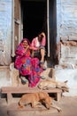 Smiling Indian women poses for a photo on the street in old town in Jodhpur, India Royalty Free Stock Photo