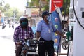 Jodhpur, Rajasthan, India - May 20 2020: Gas Station Worker Wearing Mask Refilling Petrol In Bike At Service Station After Ease In