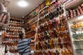 Shop owner bringing down colorful Rajsathani ladies shoes are being sold at famous Sardar Market and Ghanta ghar Clock tower in