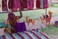 Jodhpur, Rajasthan, India - 19th October 2019 : Old aged Rajasthani woman selling hand made Rajaasthani colourful dolls of camels